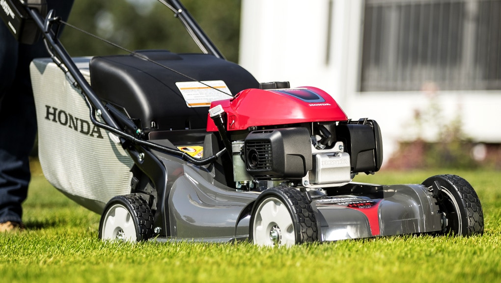 Close up view of a lawn mower on grass